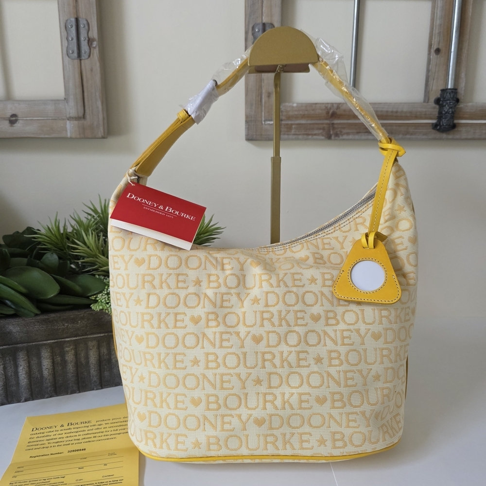 Dooney & Bourke Large Bucket Bag Sunflower Logo Canvas Leather Trim- New